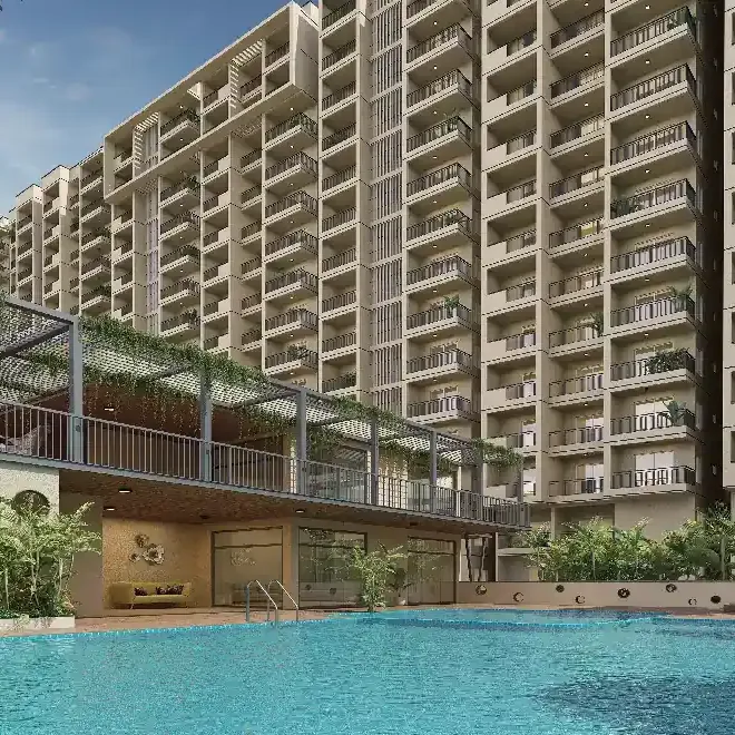 A swimming pool beside the clubhouse terrace below the towers of DS Max Sky Fields